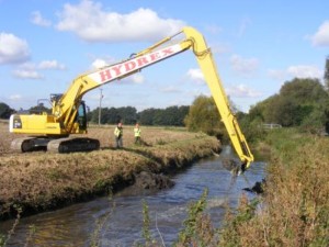 Digger carrying out river restoration at Givaudan