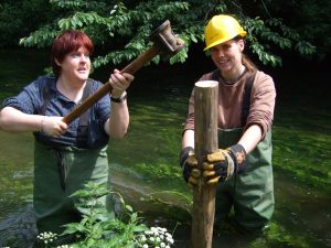 debbie & Rosie hammering in posts