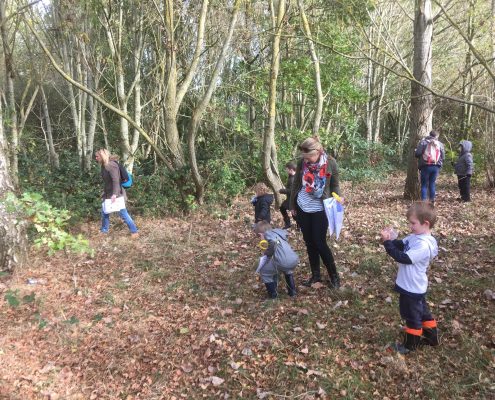 children enjoying art event in woods