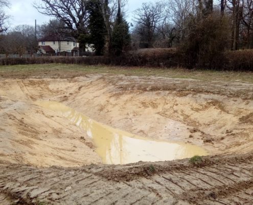 excavated depression with rainwater